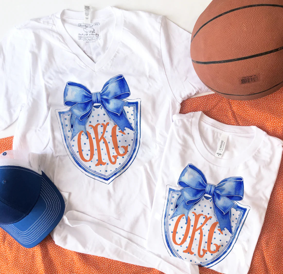 CJ OKC Coquette Shield V-Neck Graphic Tee