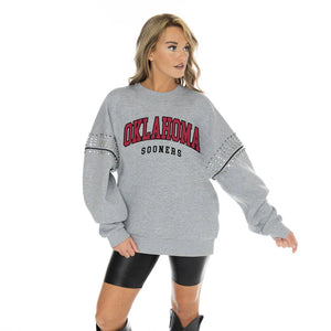 OKLAHOMA SOONERS COMPETITIVE EDGE OVERSIZED DROP SHOULDER CREWNECK FLEECE PULLOVER WITH RHINESTONE AND HEMATITE SHOULDER EMBELLISHMENTS